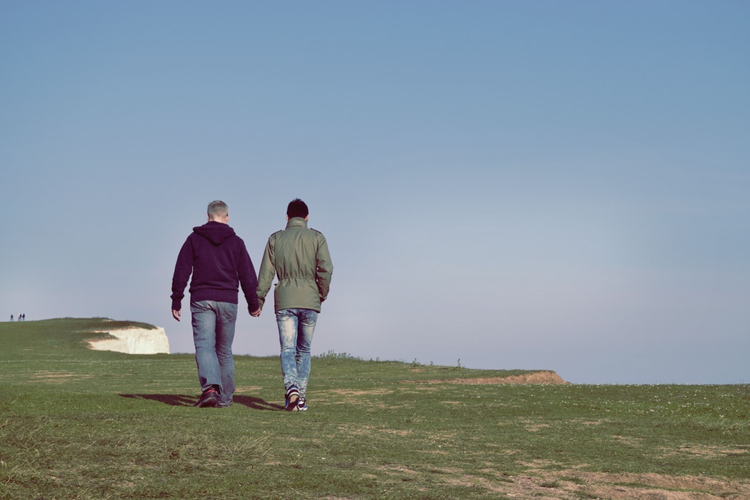 Two LGBT men walking on holiday